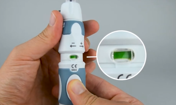 Holding an InsuJet needle-free injector
